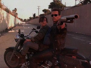 [Terminator protecting the young John Connor.]