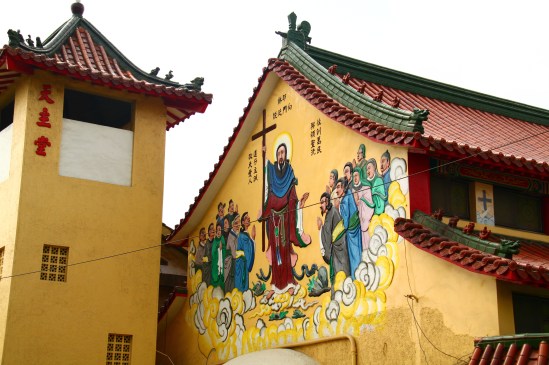 [Look! There's a mural! You can tell by the clouds this ain't Medieval or European or American or anything like that. Betcha neva seen Jesus look like that before!]