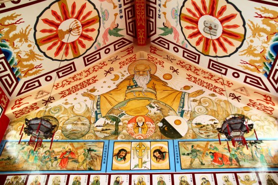 [Then of course, we tun around and see what's behind us: a mural of God in Creation-mode, among other stories and saints.]