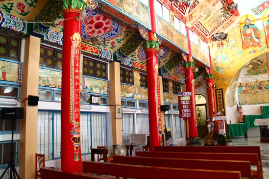 [Red columns support the ceiling here, probably columns of wood since Traditional Chinese architecture for sacred spaces tended toward precious woods (like teak) rather than precious stones.]